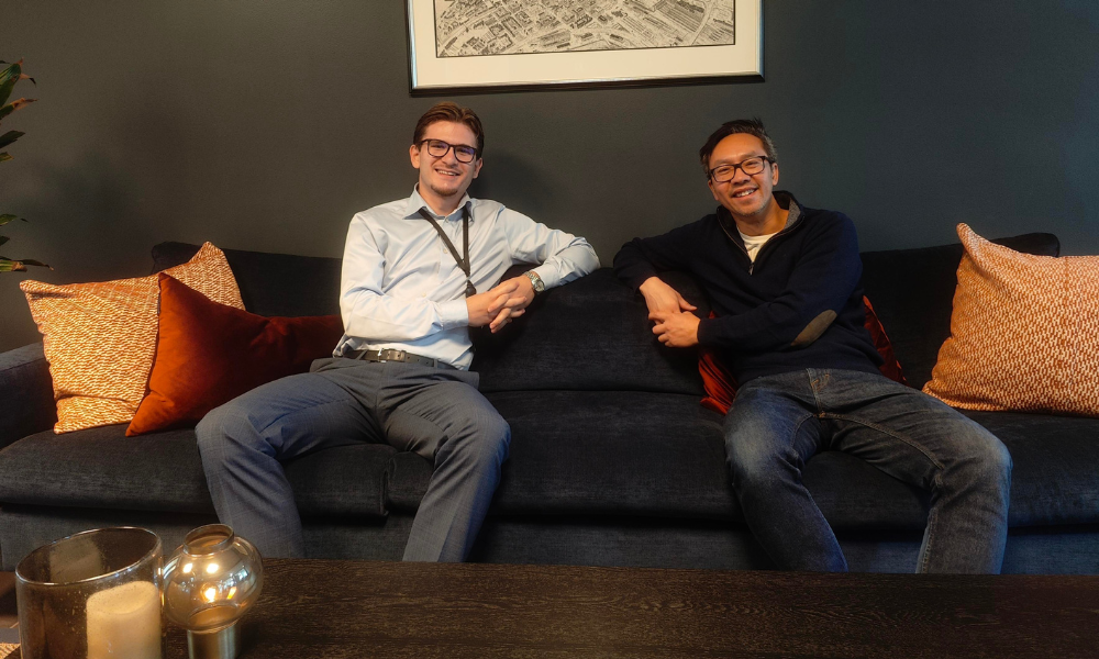 caucasion and asian guys sitting in a couch