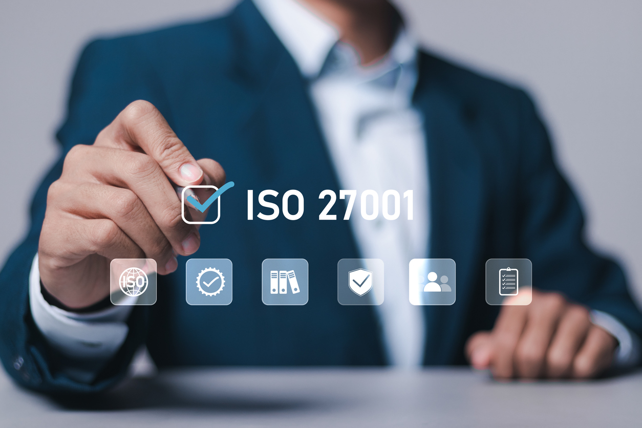 man ticking of a checklist with the word ISO 27001