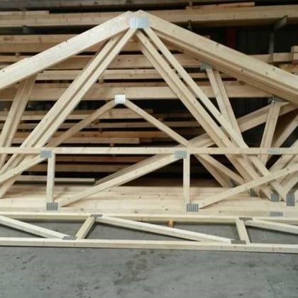 Wooden building materials connected with metal nail plates