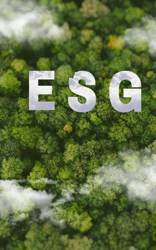 ESG letters over a lush green forest with clouds