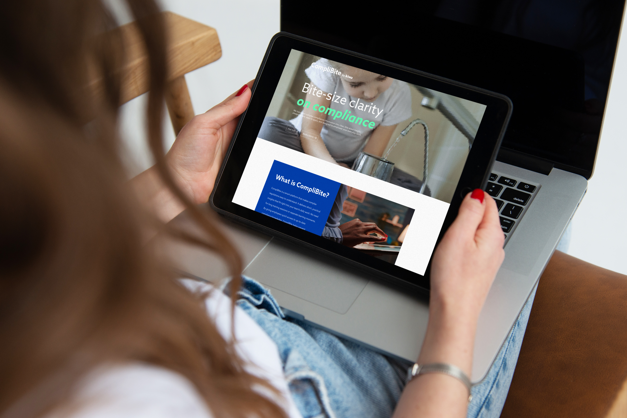 Woman using CompliBite by Kiwa on a tablet 