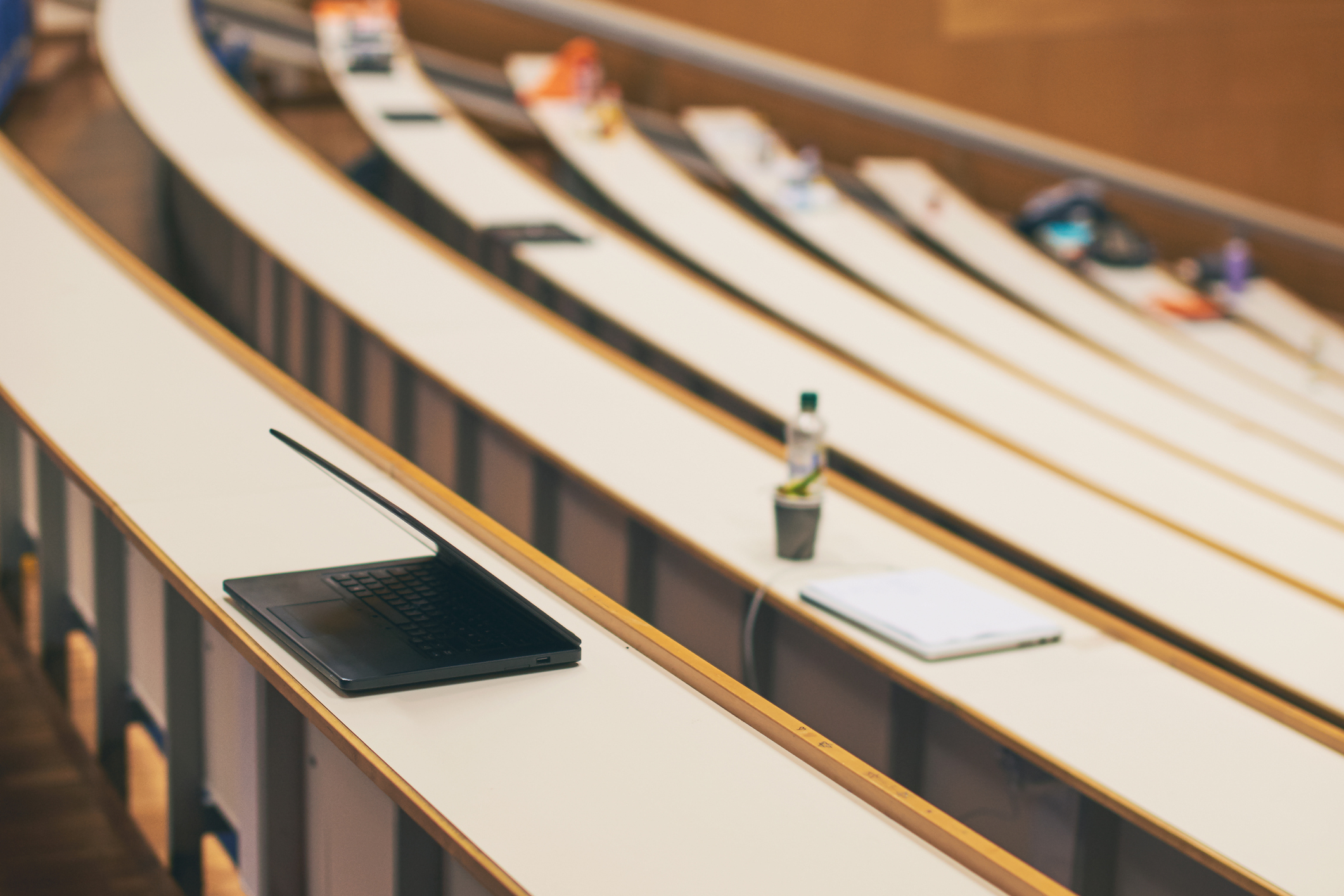 classrom with a laptop and notebooks