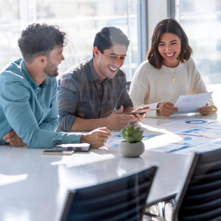 healthy work environment with three people enjoying group work