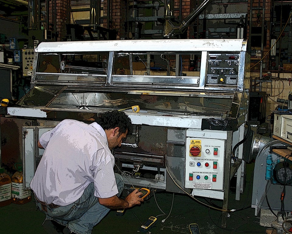 Employee testing a catering equipment