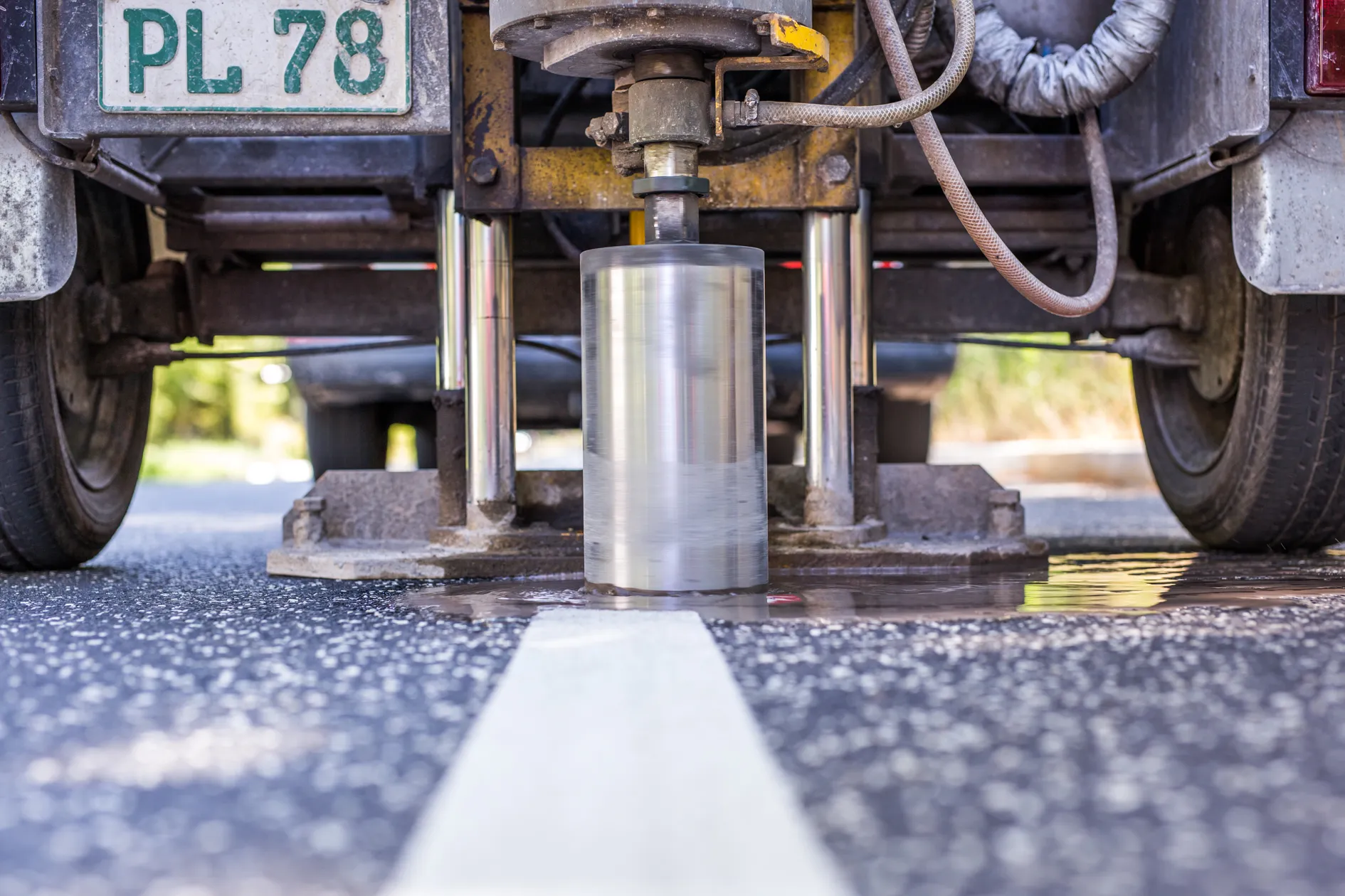 Urban highway interchange at dusk with dynamic light trails, showcasing modern infrastructure and transportation in a metropolitan cityscape.